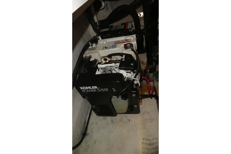 Slide: The Image of Engine compartment of 2005 Sea Ray 340 Sundancer with Kohler power system. - 26