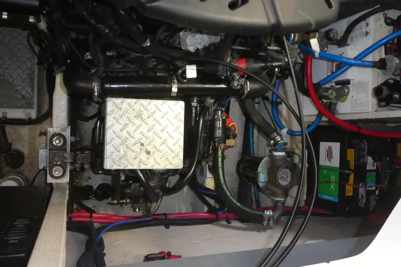 Slide: The Image of Engine compartment of a 2005 Sea Ray 340 Sundancer with visible wiring and components. - 27