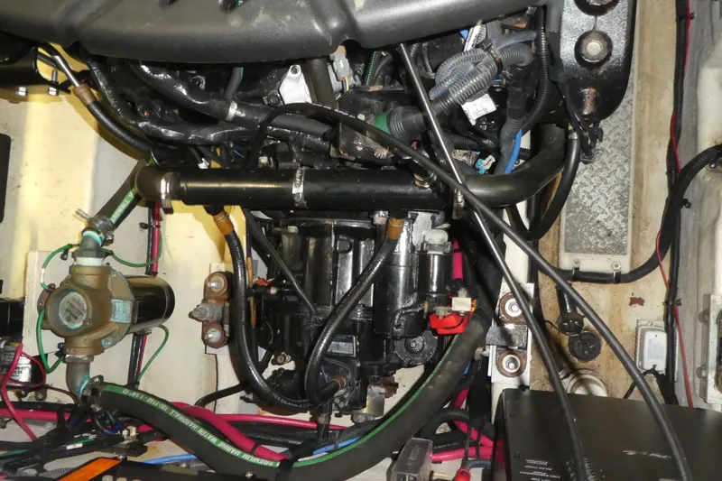 Slide: The Image of Engine compartment of a 2005 Sea Ray 340 Sundancer boat, showcasing mechanical components. - 28