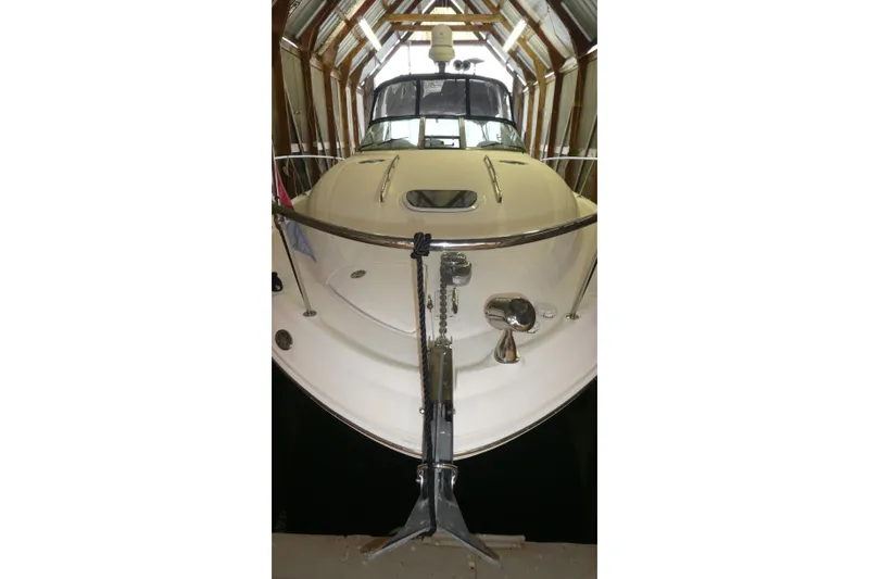 Slide: The Image of 2005 Sea Ray 340 Sundancer yacht docked in a covered marina. - 29
