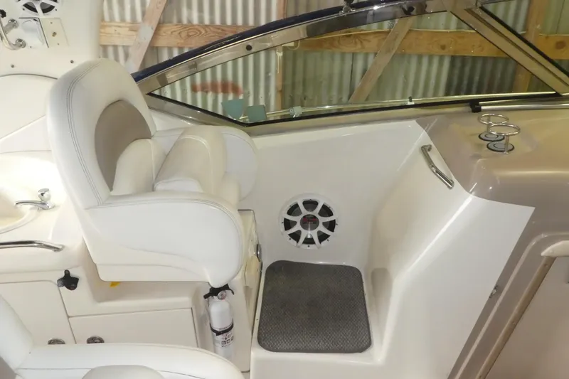 Slide: The Image of Interior of 2005 Sea Ray 340 Sundancer boat with white seating and speaker. - 7