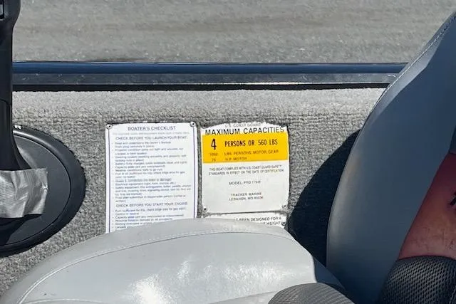 Slide: The Image of 2008 Tracker Pro Team 175 TXW boat capacity label, seating for four, 560 lbs limit. - 10