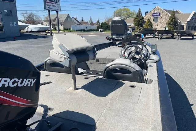 Slide: The Image of 2008 Tracker Pro Team 175 TXW boat with Mercury engine, parked outdoors. - 3
