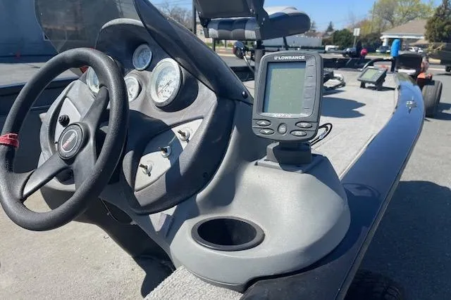 Slide: The Image of 2008 Tracker Pro Team 175 TXW boat dashboard with steering wheel and Lowrance fish finder. - 4