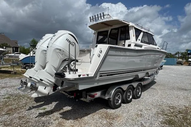 Slide: The Image of 2026 Cutwater C-288 Coupe boat with dual Yamaha engines on a trailer. - 10