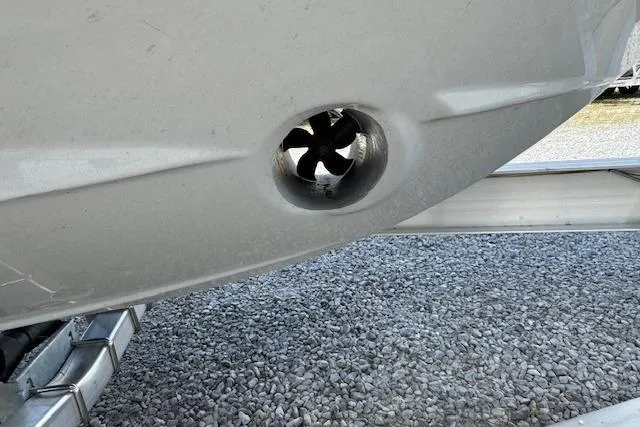 Slide: The Image of Close-up of 2026 Cutwater C-288 Coupe's bow thruster on a gravel surface. - 12