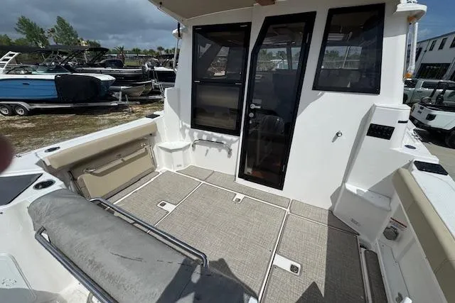 Slide: The Image of 2026 Cutwater C-288 Coupe boat interior with seating and storage compartments. - 14