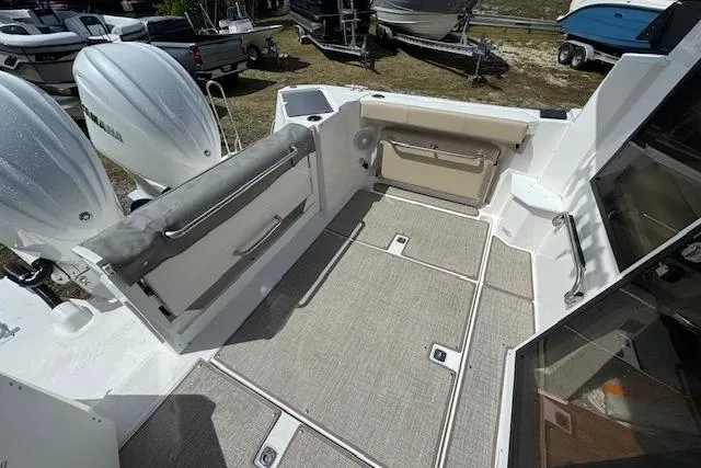 Slide: The Image of 2026 Cutwater C-288 Coupe boat deck with seating and twin outboard engines. - 15