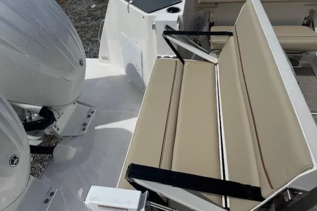 Slide: The Image of 2026 Cutwater C-288 Coupe boat with beige seating and dual outboard engines. - 18