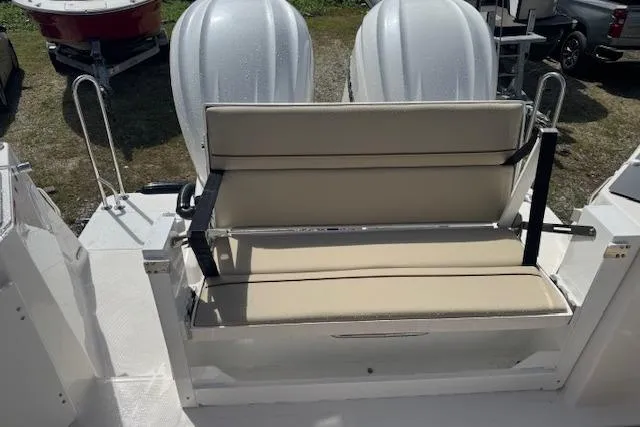 Slide: The Image of 2026 Cutwater C-288 Coupe boat with beige seating and dual outboard motors. - 19