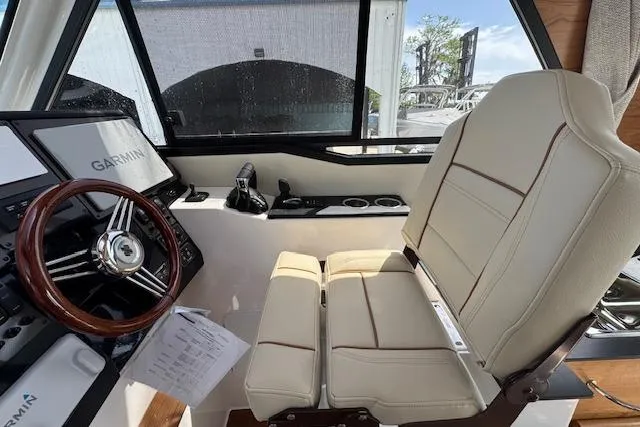 Slide: The Image of 2026 Cutwater C-288 Coupe helm with Garmin navigation, luxurious seating, and modern controls. - 26