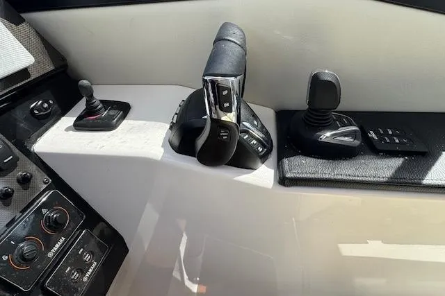 Slide: The Image of Control panel of 2026 Cutwater C-288 Coupe boat with modern throttle and joystick. - 30