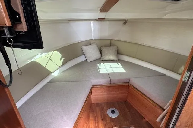 Slide: The Image of Interior cabin of 2026 Cutwater C-288 Coupe with cozy seating and cushions. - 32