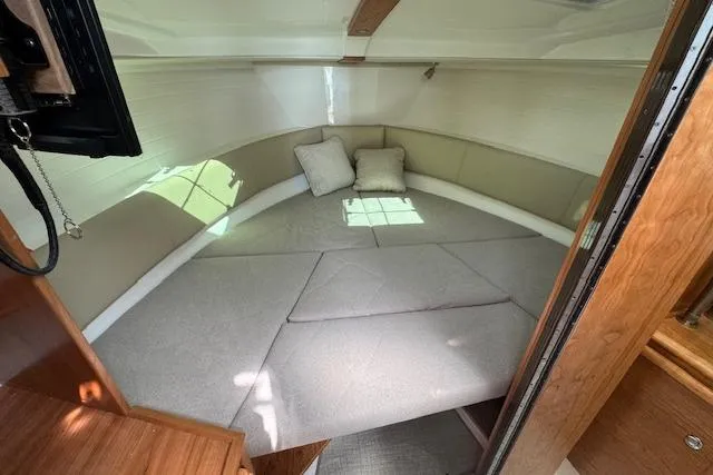 Slide: The Image of 2026 Cutwater C-288 Coupe interior cabin with cozy bedding and cushions. - 37