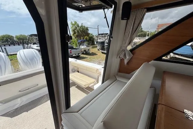 Slide: The Image of Interior view of 2026 Cutwater C-288 Coupe, showcasing seating and outdoor access. - 40