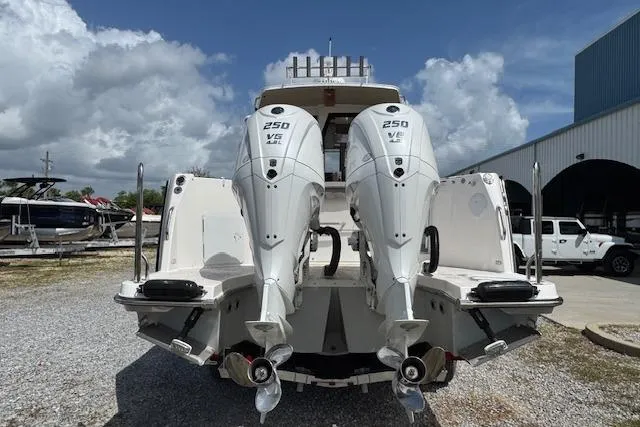 Slide: The Image of 2026 Cutwater C-288 Coupe with dual 250 V6 outboard engines, rear view. - 9