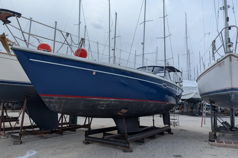 The Image of Sailboat Catalina 36 MkII 1995 on dry dock, surrounded by other vessels. - 0