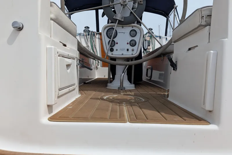 Slide: The Image of Cockpit of a 1995 Catalina 36 MkII sailboat with steering wheel and seating. - 11