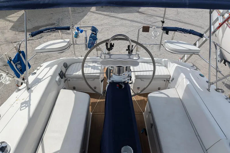 Slide: The Image of Interior of a 1995 Catalina 36 MkII sailboat with cozy seating and wooden finishes. - 13