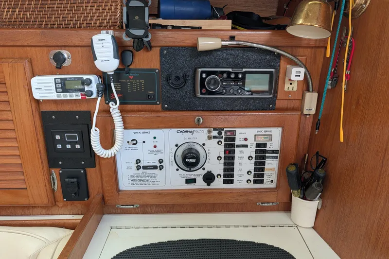 Slide: The Image of Electrical panel of a 1995 Catalina 36 MkII yacht with various switches and controls. - 15
