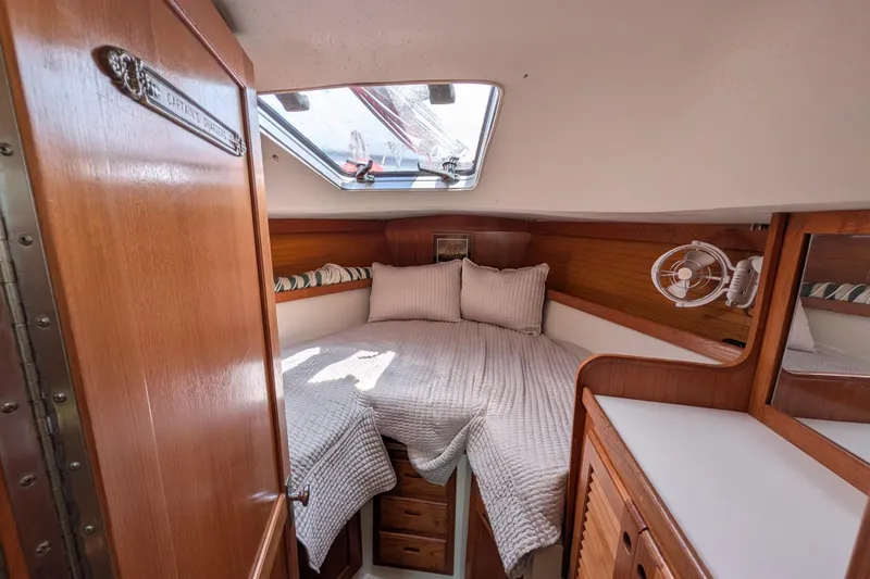 Slide: The Image of Control panel of a 1995 Catalina 36 MkII yacht with communication and navigation equipment. - 16