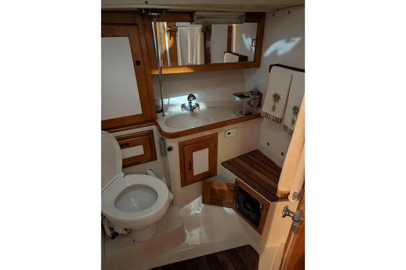 Slide: The Image of Bathroom interior of 1995 Catalina 36 MkII yacht with wooden accents and fixtures. - 7