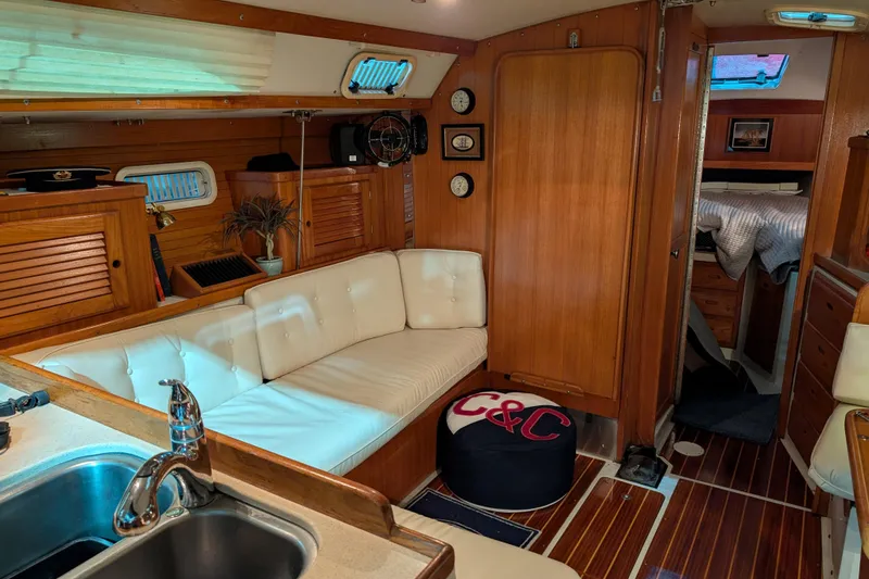 Slide: The Image of Interior of a 1995 Catalina 36 MkII sailboat with cozy seating and wooden finishes. - 8