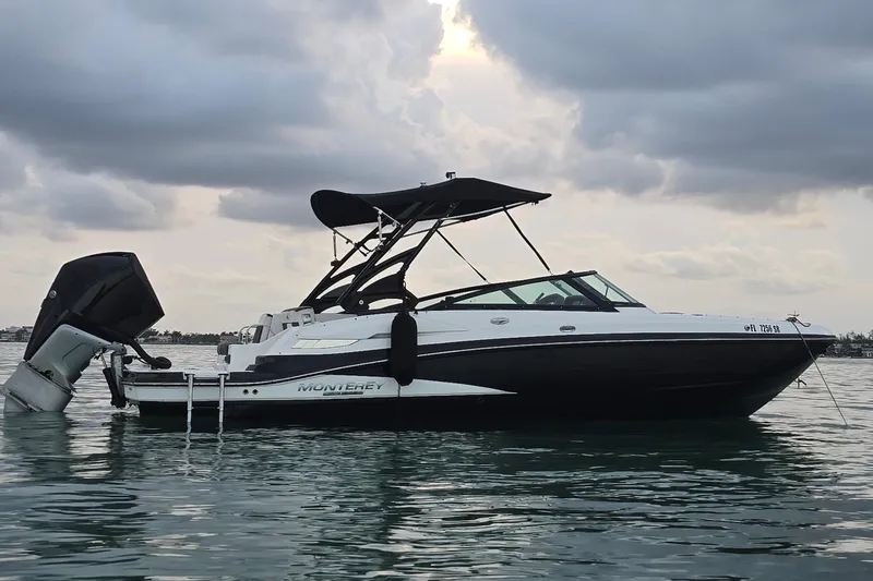 The Image of 2020 Monterey M-45 boat on calm water under cloudy sky. - 0