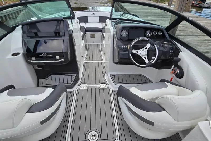 Slide: The Image of Interior view of a 2020 Monterey M-45 boat with modern dashboard and seating. - 10