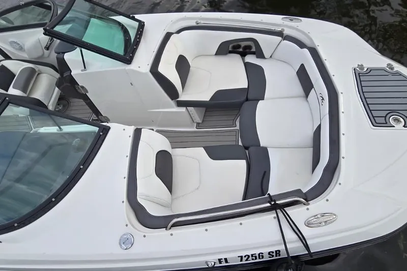 Slide: The Image of 2020 Monterey M-45 boat interior with white and gray seating, open windshield, and sleek design. - 11