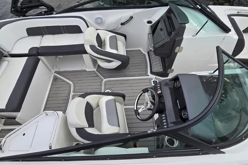 Slide: The Image of 2020 Monterey M-45 boat interior with sleek seating and modern dashboard design. - 12