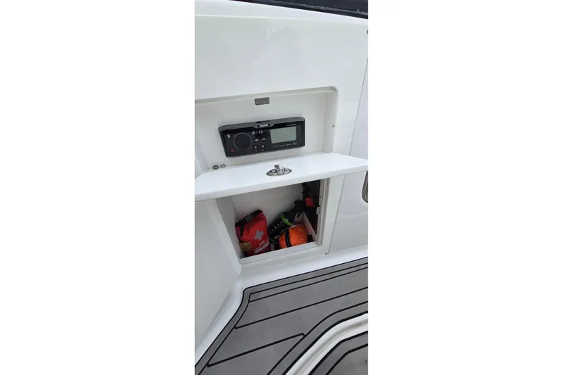 Slide: The Image of 2020 Monterey M-45 boat storage compartment with stereo and safety gear. - 21