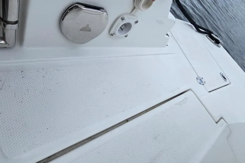 Slide: The Image of 2020 Monterey M-45 boat deck with textured surface and metal fixtures near water. - 24