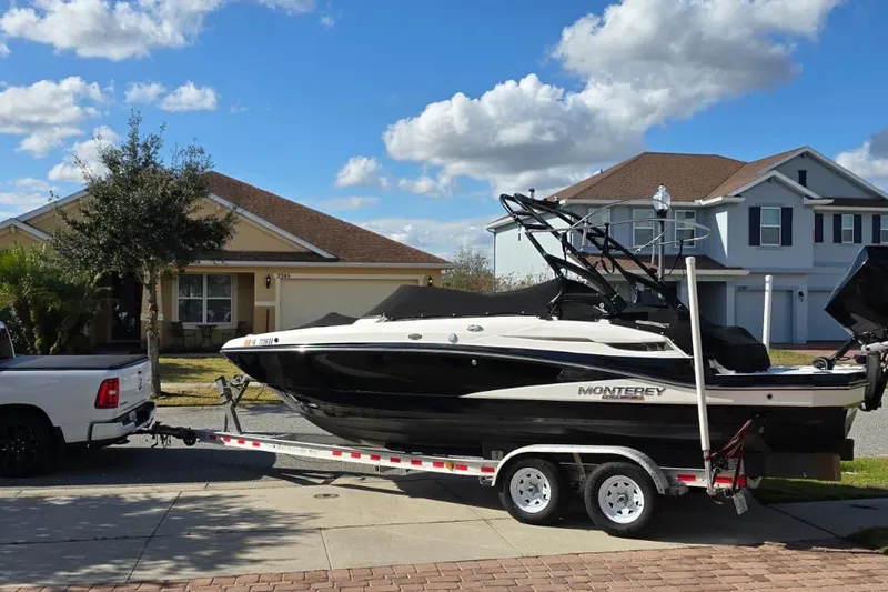 Slide: The Image of Truck towing a 2020 Monterey M-45 boat on a trailer in a suburban neighborhood. - 29