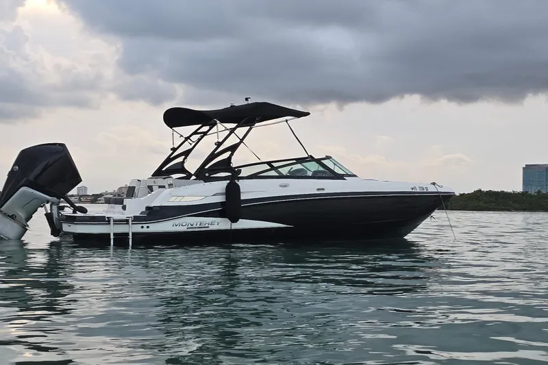 Slide: The Image of 2020 Monterey M-45 boat on calm water under cloudy sky. - 38