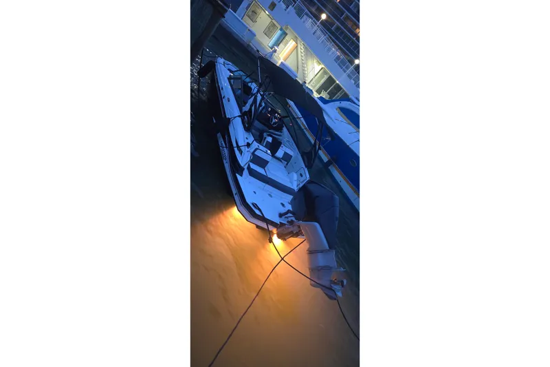 Slide: The Image of 2020 Monterey M-45 boat docked at night with underwater lights glowing. - 40