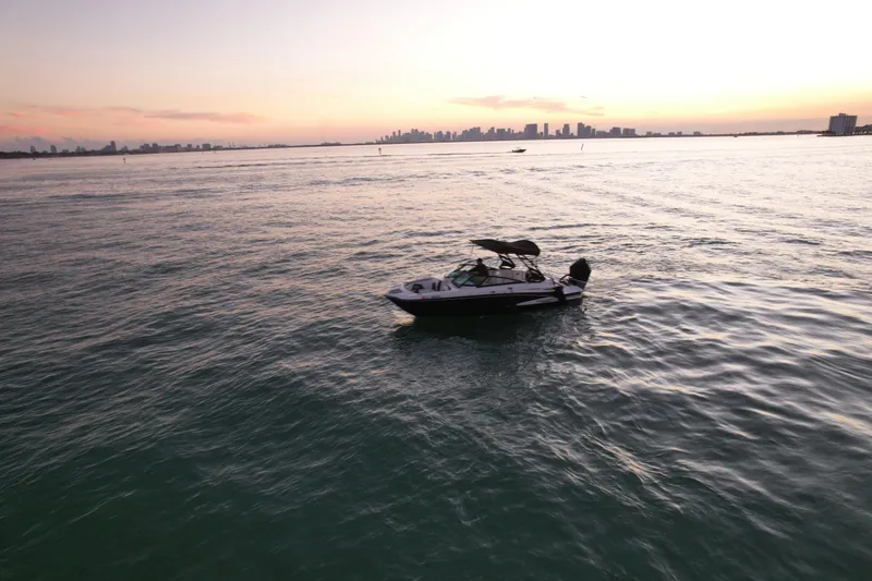 Slide: The Image of Boat on calm water at sunset, Monterey M-45, 2020 model, city skyline in background. - 42