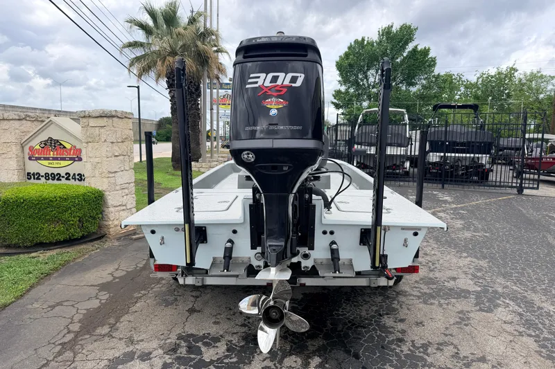 Slide: The Image of 2018 SCB Stingray boat with 300 XS engine, parked outdoors. - 1