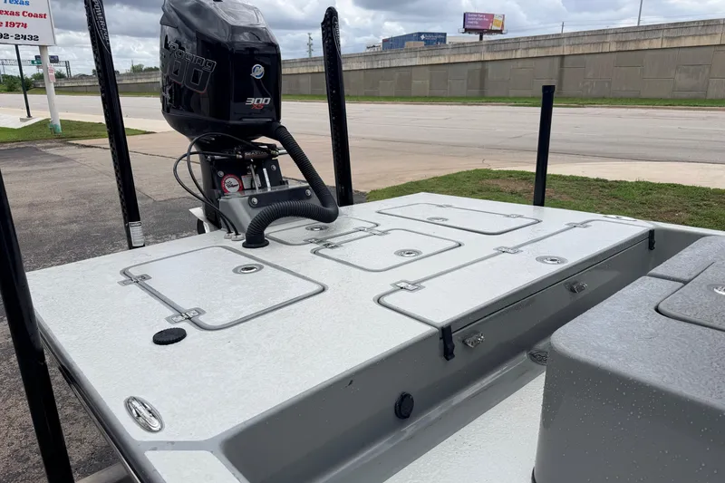 Slide: The Image of 2018 SCB Stingray boat with powerful 300 horsepower engine, parked near a road. - 10