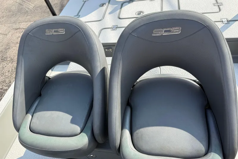 Slide: The Image of Two SCB Stingray 2018 boat seats with sleek, modern design on deck. - 23