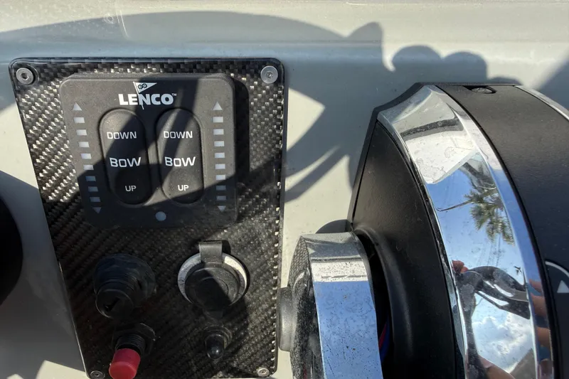 Slide: The Image of Control panel of a 2018 SCB Stingray boat with Lenco trim tab switches. - 27