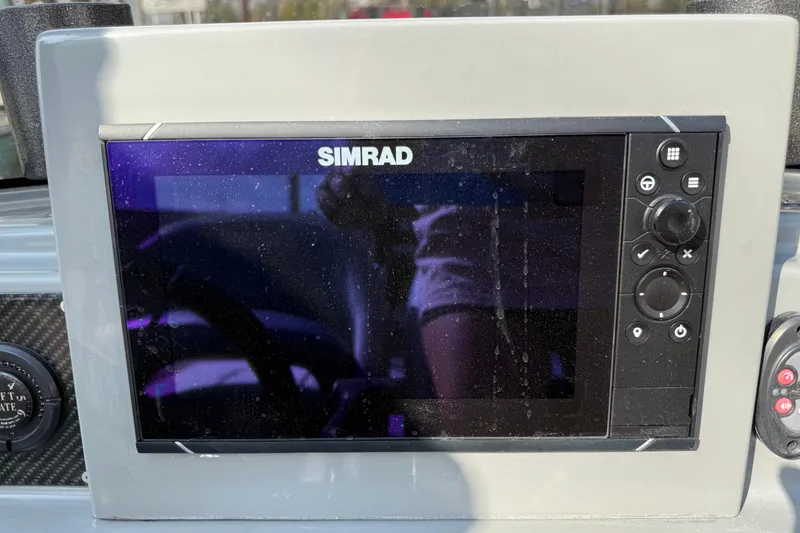 Slide: The Image of Simrad display on 2018 SCB Stingray boat dashboard, showing control buttons. - 30