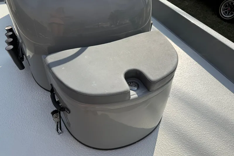 Slide: The Image of 2018 SCB Stingray boat seat with integrated cup holder on textured deck. - 32