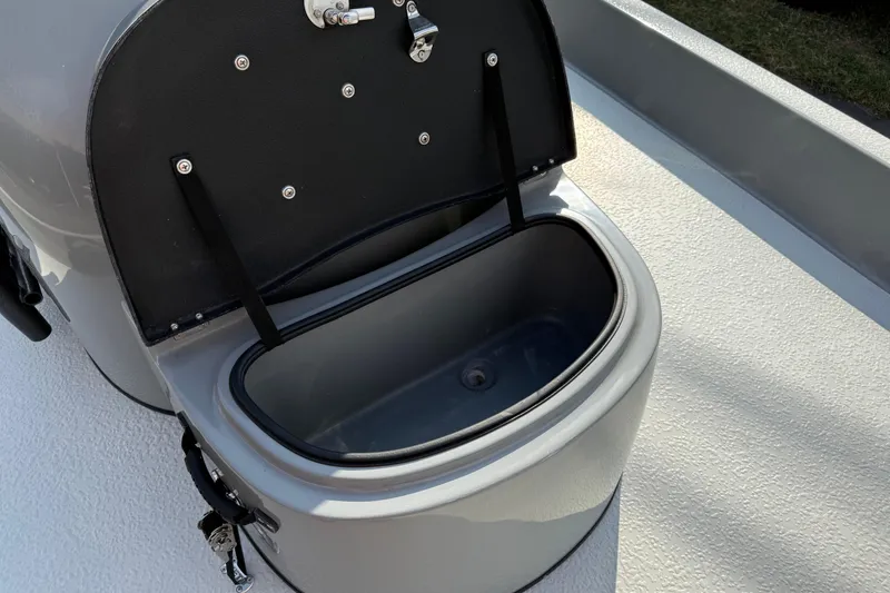 Slide: The Image of Open storage compartment on 2018 SCB Stingray boat, featuring a sleek design and secure latch. - 33