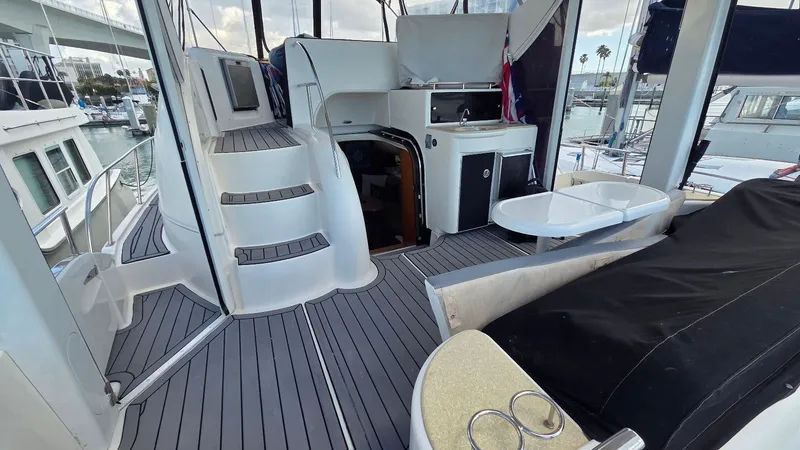 Slide: The Image of Interior of a 2004 Meridian 459 Motoryacht with stairs and seating area. - 11