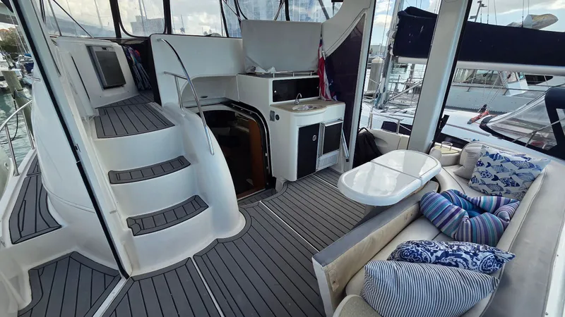 Slide: The Image of Interior of a 2004 Meridian 459 Motoryacht with seating area and stairs. - 15