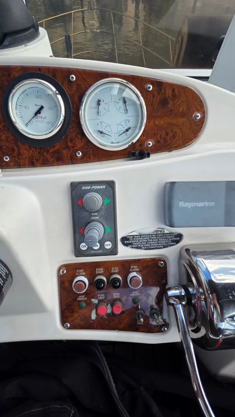 Slide: The Image of 2004 Meridian 459 Motoryacht helm with gauges and controls. - 19