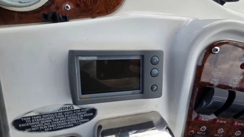 Slide: The Image of 2004 Meridian 459 Motoryacht helm with Raymarine display. - 22