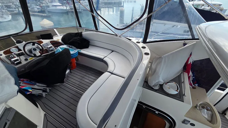 Slide: The Image of Interior of a 2004 Meridian 459 Motoryacht with helm and seating area. - 23