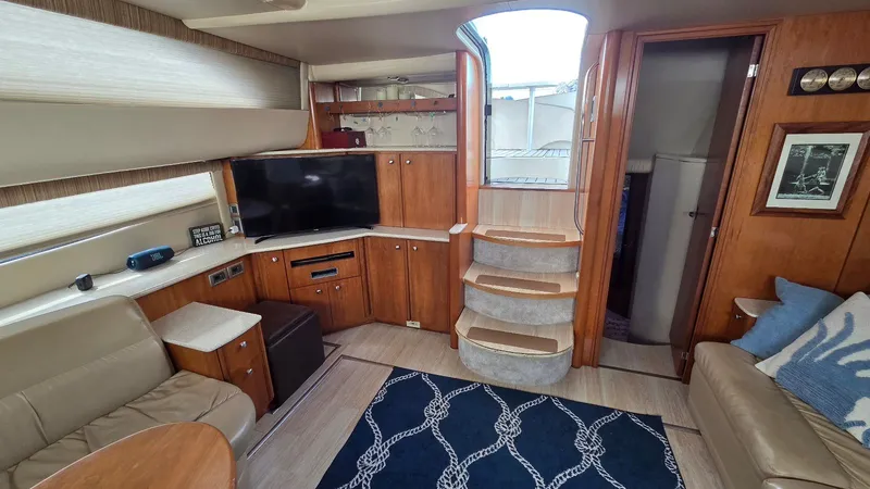 Slide: The Image of Interior of a 2004 Meridian 459 Motoryacht with TV and leather sofas. - 36
